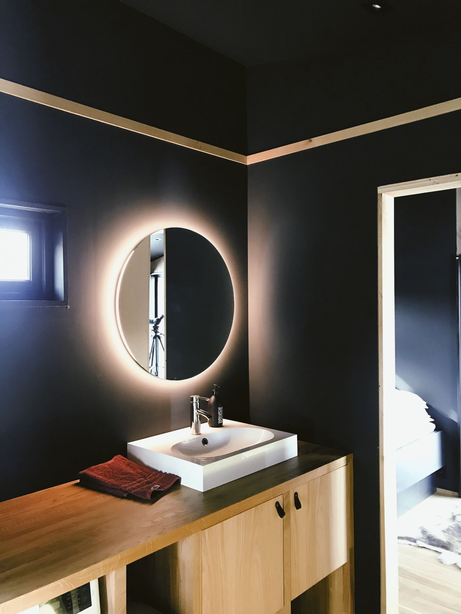 LED Bathroom Mirror Glowing in the Bathroom 