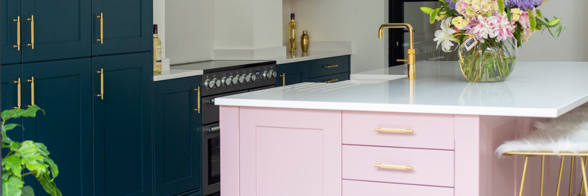 Stoneham Kitchen in navy and pink featuring a brass tap