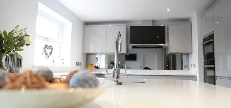 Kitchen Case Study: Smoked Mirror Splashback and Gleaming White Worktops image