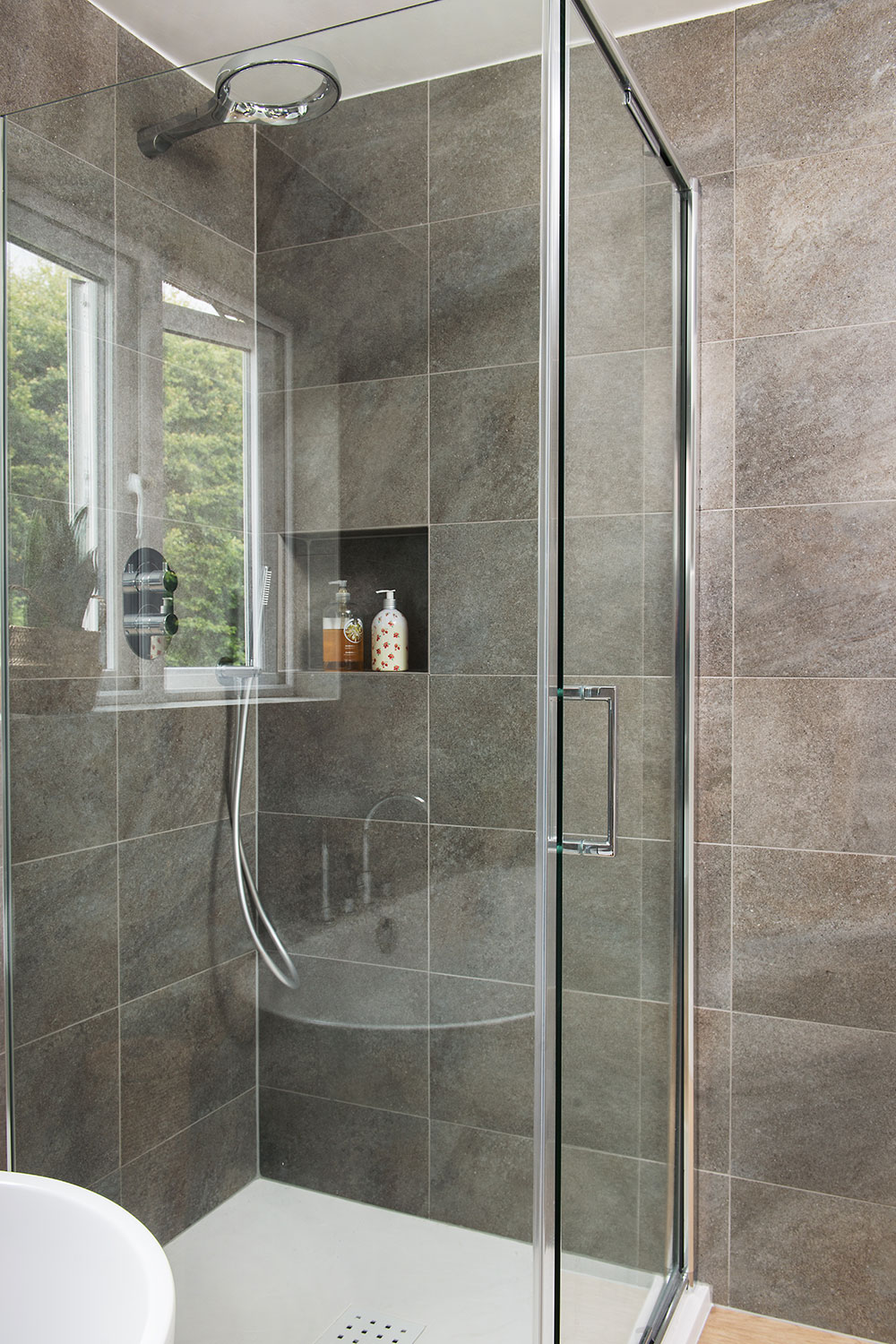 Anna's minimal look shower area with tiled alcove.