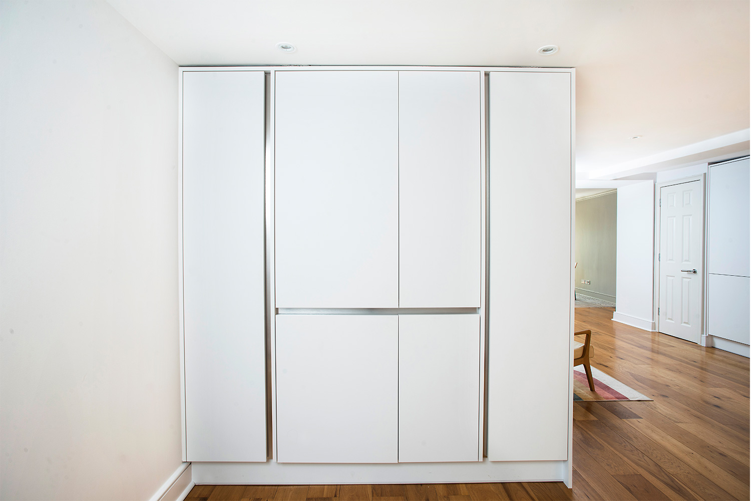 Closed white drinks bar cupboard