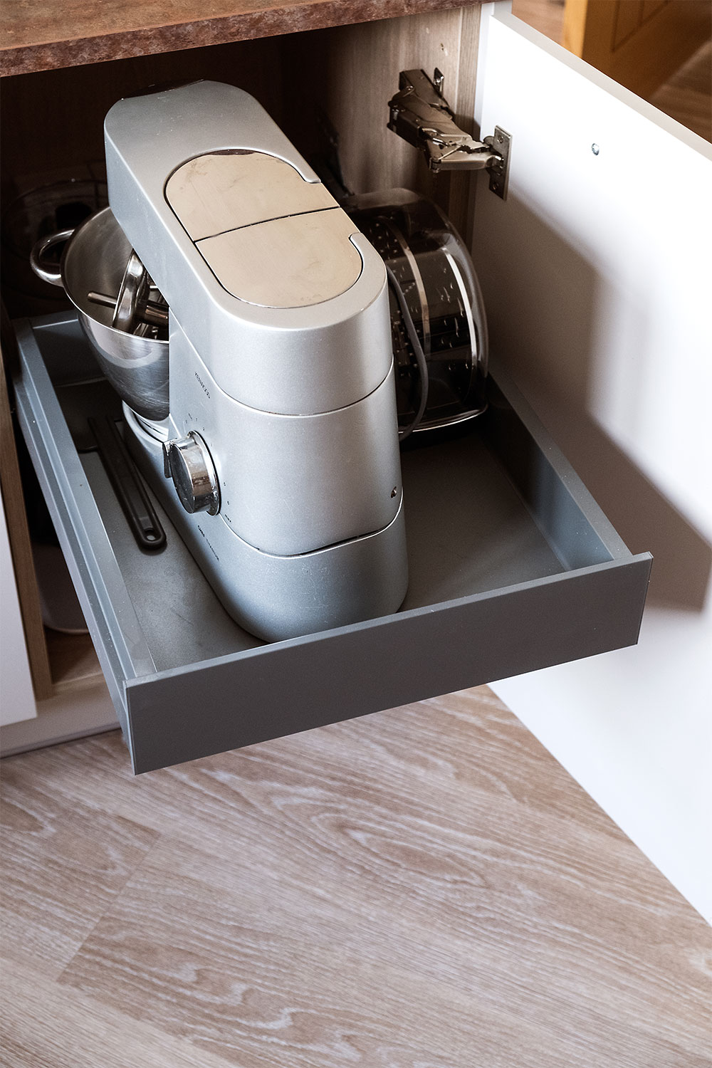 A specially designed drawer to hold Naomi's food mixer.