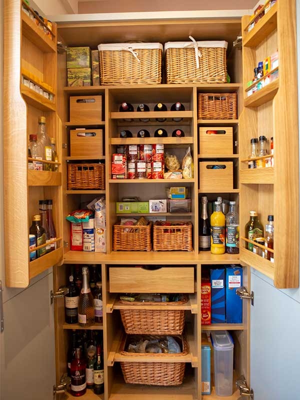 Wooden pantry with hyacinth baskets