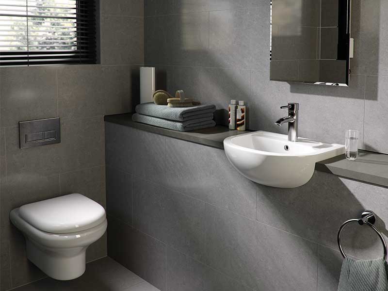 RAK dark bathroom with white sanitaryware.