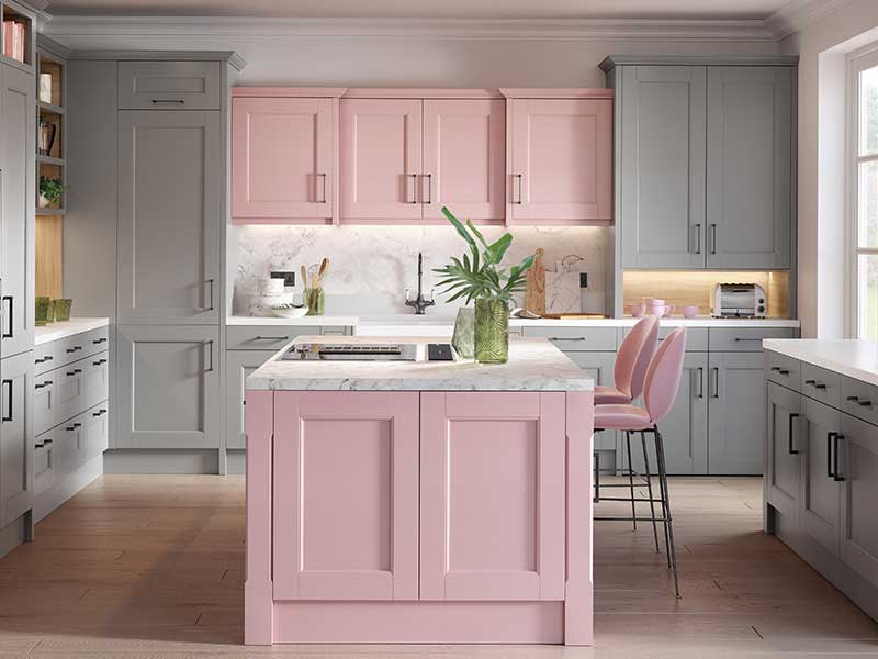 Blush pink and light grey kitchen with breakfast bar