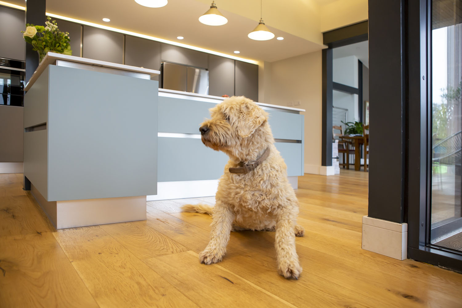 Crowm Imperial handle-less kitchen in modern barn conversion designed and fitted by Gardiner Haskins