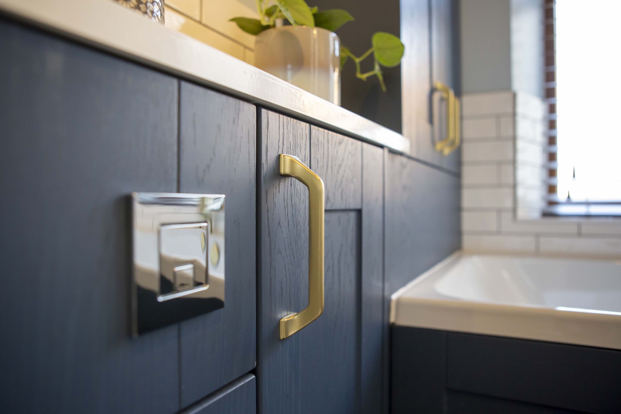 Real customer bathroom blue cabinets and brass taps