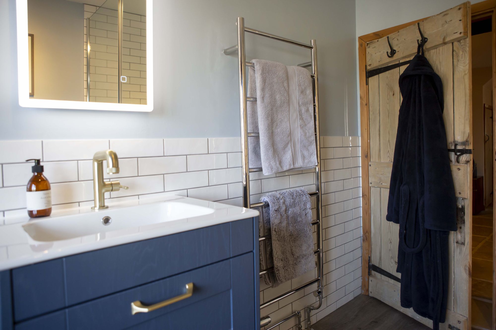 Rela customer bathroom deep blue bathroom cabinets from Gardiner Haskins 