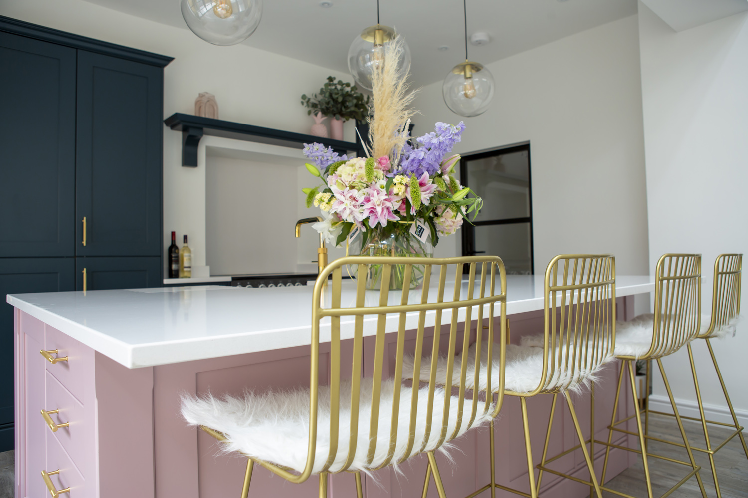 Stoneham Kitchen with gold bar stools at a dusky pink kitchen island