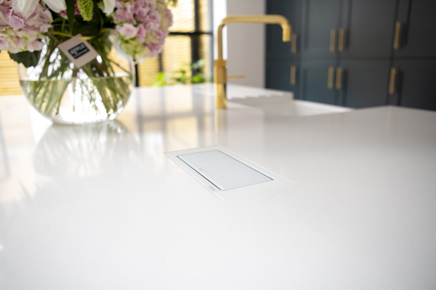 Plug socket hidden in a kitchen island worktop