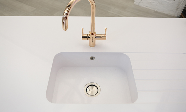 Square white acrylic sink with white worktop