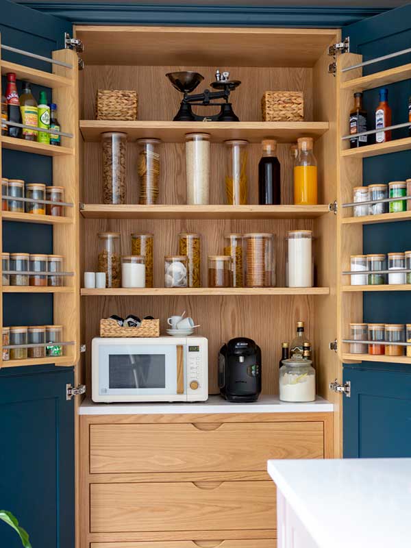 Stoneham Kitchen Pantry with wooden shelves and frame painted in dark blue